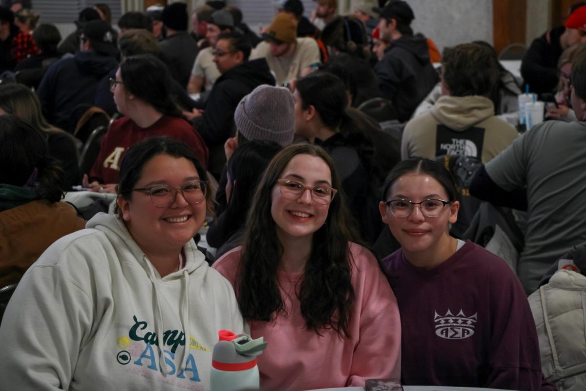 Sisters of Alpha Sigma Alpha smile at the all-Greek Bingo competition.